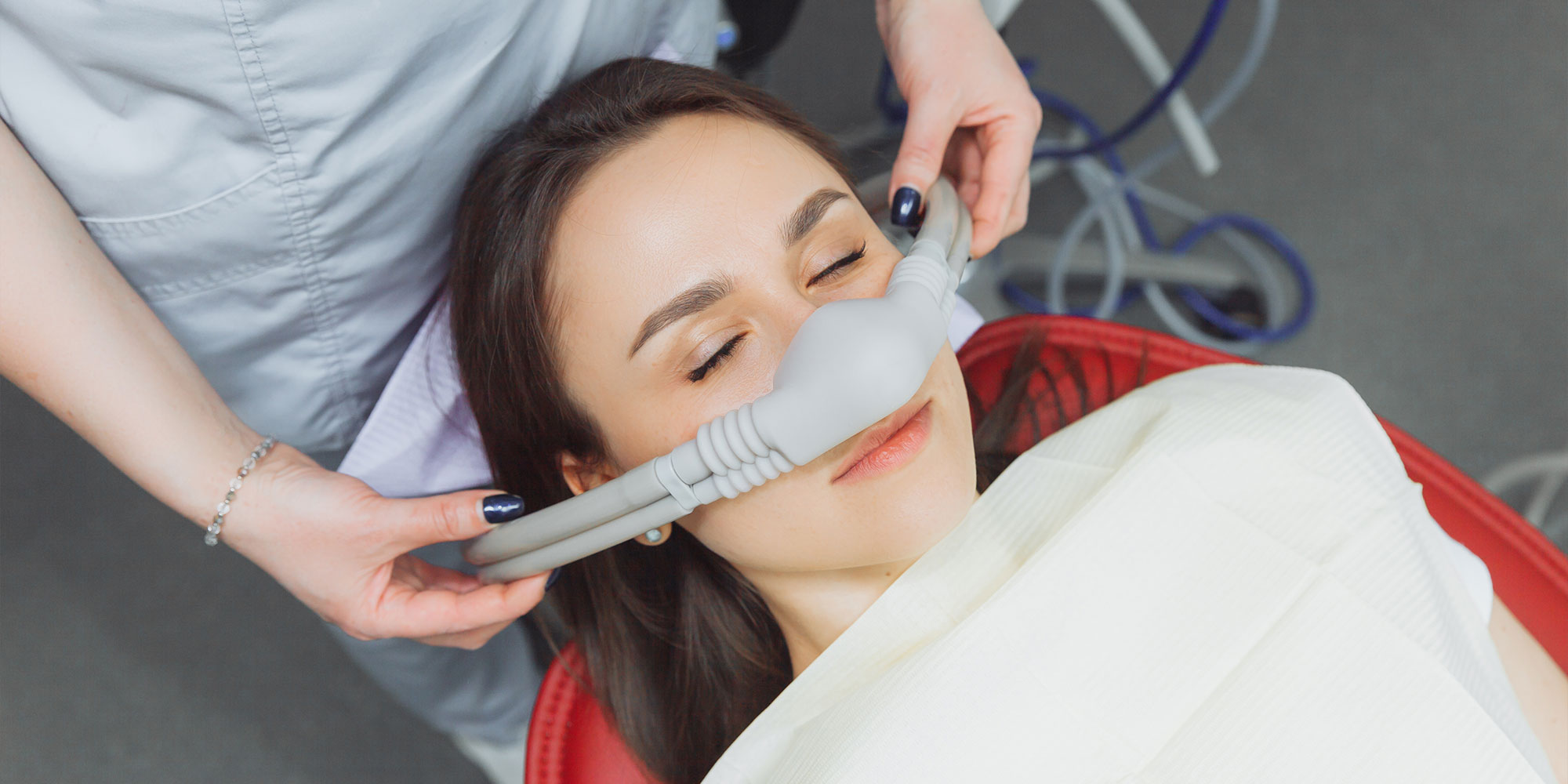 young female patient undergoing sedation for dental treatment