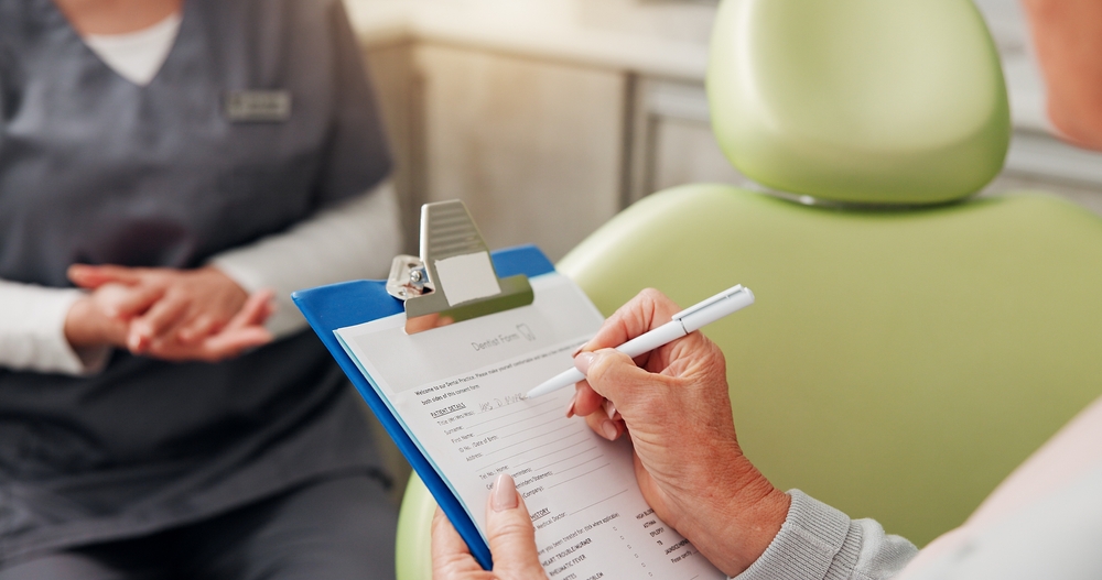 Dentist in Hannibal, MO consulting with a family in a modern dental office